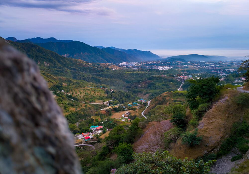 A group of adventure seekers trekking towards the George Everest Peak, surrounded by scenic mountain landscapes. George Everest.