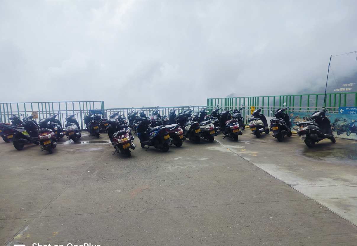 Tourists renting bikes to explore Mussoorie and Kempty Fall Road affordably.
